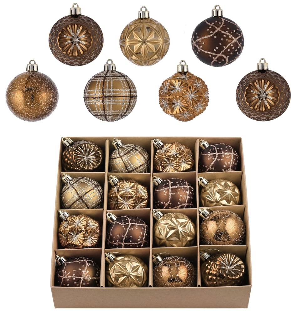 A collection of brown and gold Christmas tree decorations featuring stars, stripes, and plaid patterns. The ornaments are neatly arranged in a cardboard box with individual sections for each one.